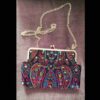 Geborduurde clutch handtas met paisleypatroon