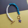 Kralenarmband voor Dames – Koraal en Blauwe Oog