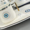 Artistiek Porseleinen Theeservies – Wit Boze Oog