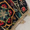 Geborduurde fluwelen clutch bloem & blad zwart