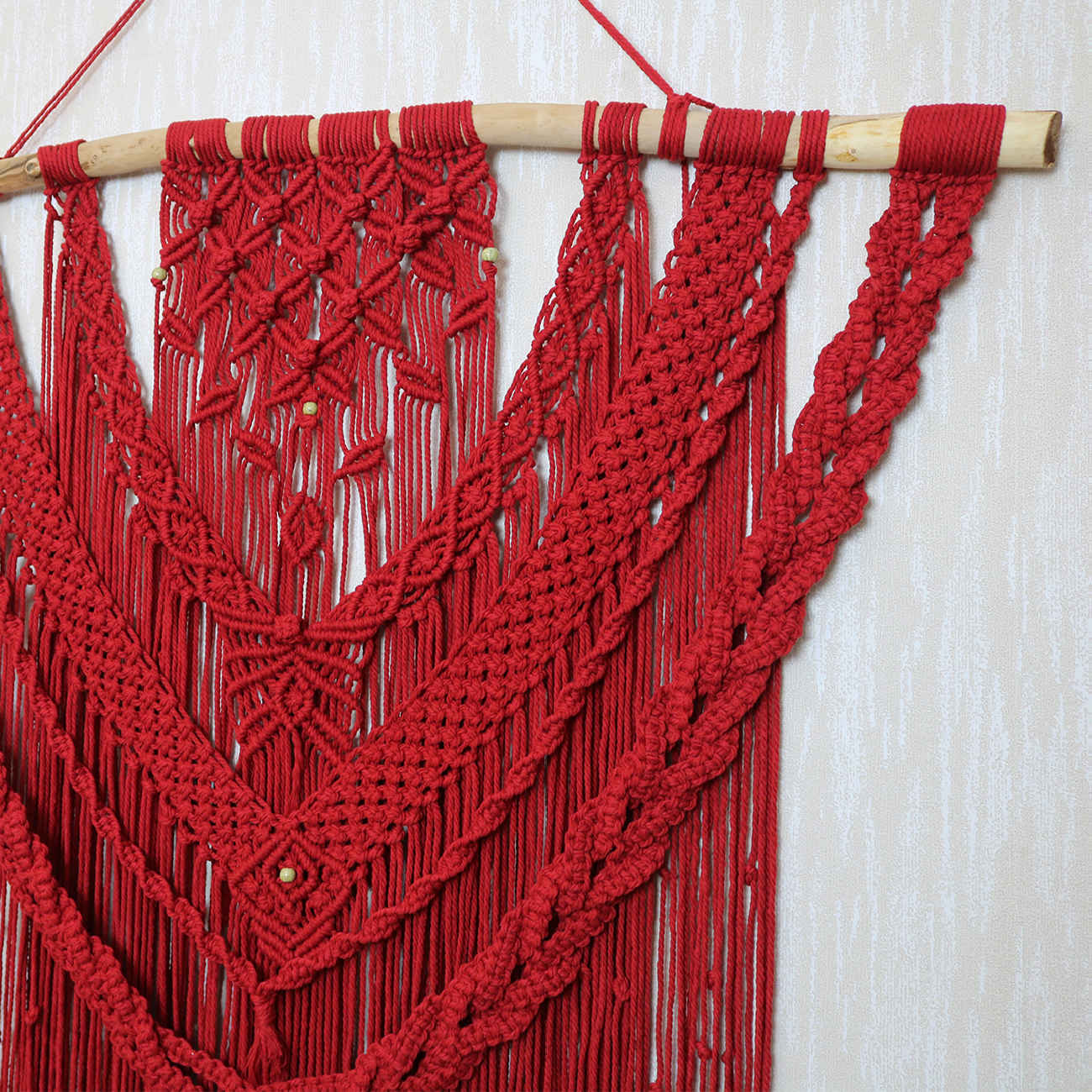 Elegante macramé wandhanger met bladpatroon