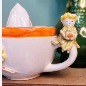 Esthetische keramische pers – pastelroze handpers voor citrusvruchten